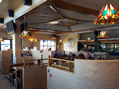 Chinook Spur interior with booths, stained-glass pendant lamps and diners