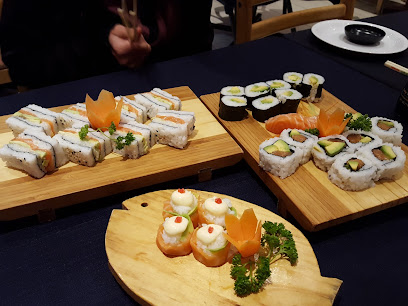 Assorted sushi and dim sum on wooden boards at Jacky’s Chinese Restaurant