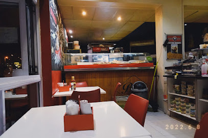 Shawarma Express interior - white tables, red chairs and glass food counter