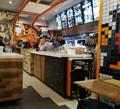 RocoMamas Vangate Mall halal counter with staff and menu screens