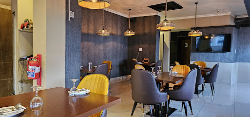 My Favor8 Rondebosch dining room with set tables and pendant lights