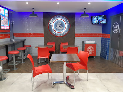 Roman's Pizza Observatory dining area with red chairs and wall logo