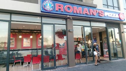 Roman's Pizza Athlone storefront with glass front and red interior seating
