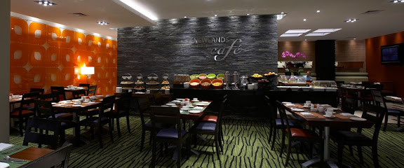 The Newlands Café dining room with buffet against a textured stone wall