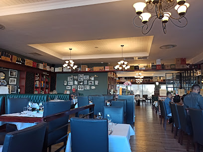 Interior dining room at The Hussar Grill Durbanville with set tables