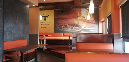 Grill Baby Parow dining area with orange booths and steak mural