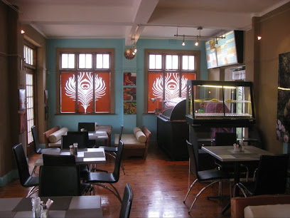 Govinda's Weekend Cafe interior with cozy seating and glass display case