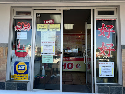 Ho Ho Take Aways storefront with glass doors, OPEN sign and Chinese characters