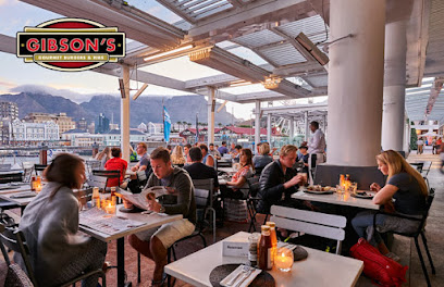 Gibson's outdoor V&A Waterfront terrace with diners at candlelit tables