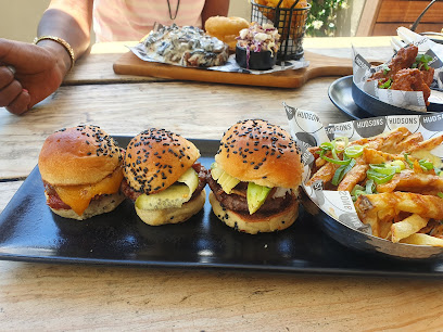Hudsons Claremont trio of mini burgers with fries on a wooden table