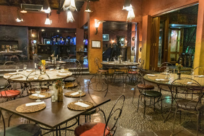 Mama Africa Cape Town dining room with set tables and warm lighting
