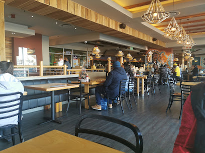 Santa Ana Spur Goodwood dining area with patrons seated at booths and tables