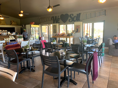 Sunlit Park Café dining area with tables, chairs and service counter