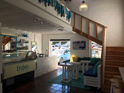 Kristen's Ice Cream Noordhoek interior with counter, bench seating and staircase