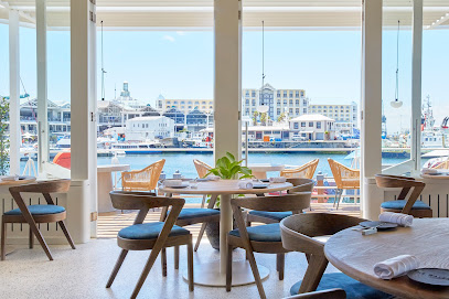 The Waterside dining room with oceanfront tables overlooking V&A Waterfront harbour