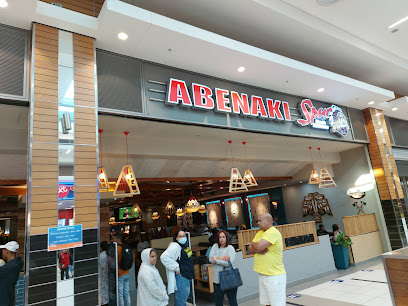 Abenaki Spur restaurant front in mall with customers waiting outside