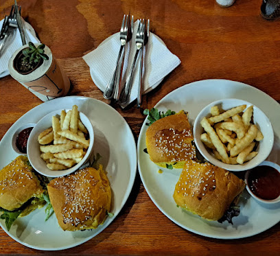 Romeo&vero vegan burgers with crinkle-cut fries on wooden table