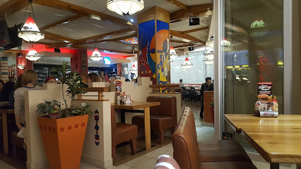 Ottawa Spur family grill interior with wooden booths and pendant lights