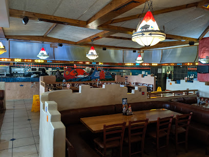 Utah Spur Milnerton dining area with booths, wooden tables, hanging lamps