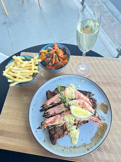 Bud Restaurant @ Alpha Gram prawn-topped steak with fries, vegetable side and sparkling wine