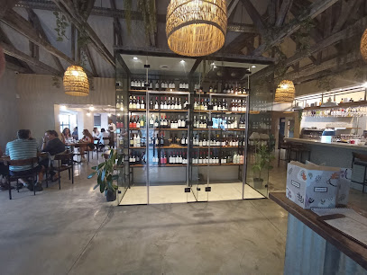 Sanook Somerset dining room with central glass wine display and bar