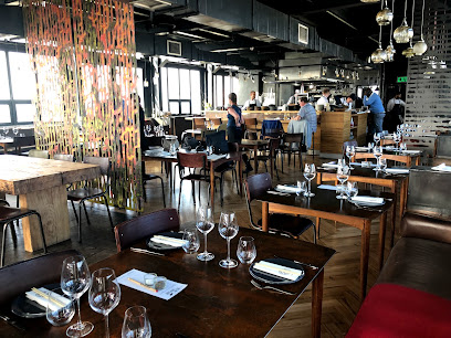 The Pot Luck Club rooftop dining room with set tables