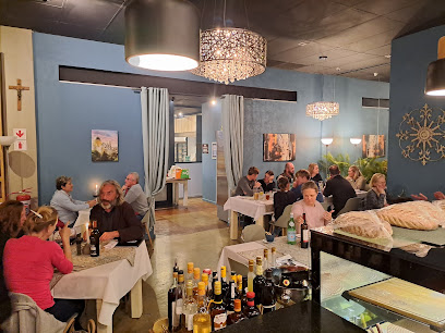 Baía Grande Portuguese Restaurant dining room with diners at white-clothed tables