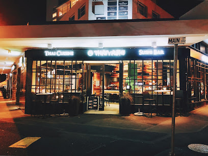 Thaiyashi restaurant exterior at night with lit dining room