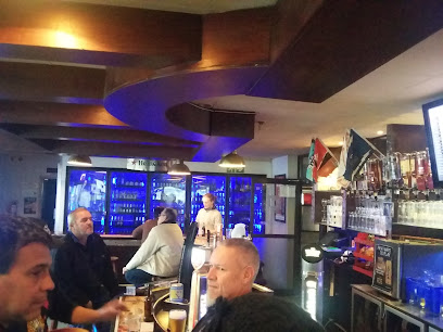 Pizza Palazzo interior in Cape Town, diners at bar with bartender and blue-lit coolers