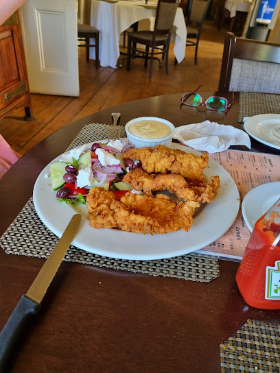 Fried crumbed chicken strips with salad and dipping sauce at The Bloemhof Grill