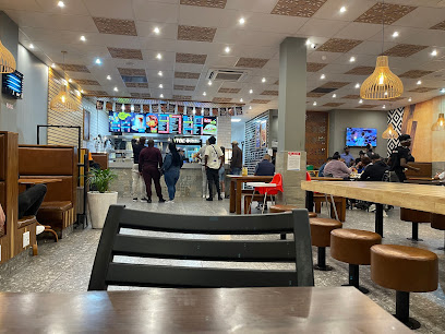 Pedro's Long Street interior with customers at counter and seating