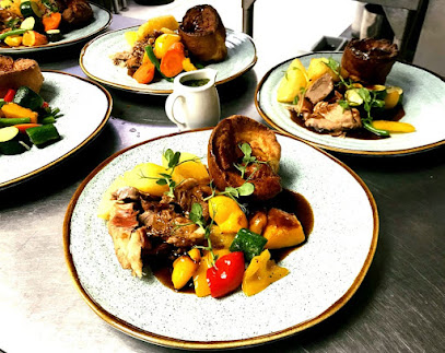 Copper Kettle Restaurant plated roast dinner with Yorkshire pudding and roasted vegetables