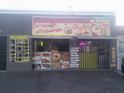 Dagbreek Roadhouse storefront with menu photos and neon OPEN sign