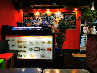 Jade Tavern Kenilworth interior with illuminated sushi menu and chalkboard specials