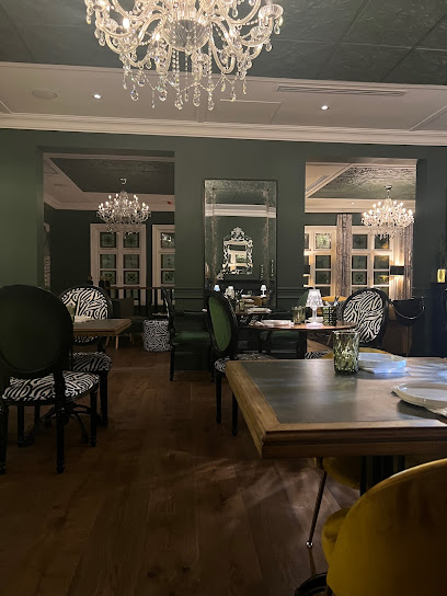 Upper Union dining room with crystal chandeliers and zebra chairs