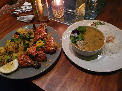 Curry Club tandoori skewers with roasted potatoes and lentil curry with rice