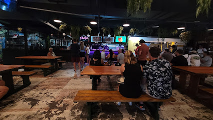 Plucky's Fried Chicken dining area with customers at counter