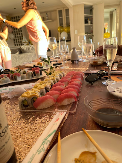 Kiwondo’s Sushi platter with nigiri and maki on a festive dining table