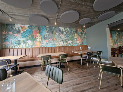 Top Stix Sushi & Bar dining area with tropical mural, banquette seating and tables