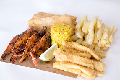 Calamari Fisheries Watergate seafood plate: grilled prawns, battered fish, calamari strips, yellow rice and fries