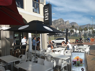 KAUAI Camps Bay seafront patio with customers and smoothie display