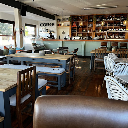 Oblivion Bar & Kitchen interior, wooden tables and bottle-lined bar counter