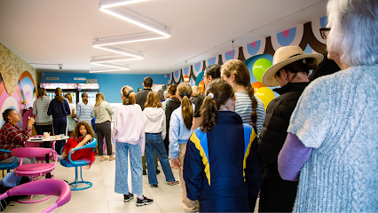 Busy queue of customers inside Kristen's Ice Cream Somerset West shop