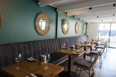 The Sanctuary Restaurant interior with banquette seating and set tables