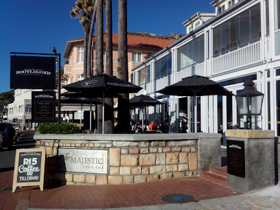 Bootlegger Kalk Bay exterior with outdoor seating and black umbrellas