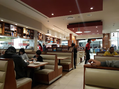 Panarottis Kenilworth Centre dining area with booths, diners and staff