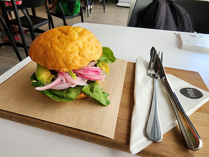 KAUAI Claremont sandwich with greens and pickled red onions