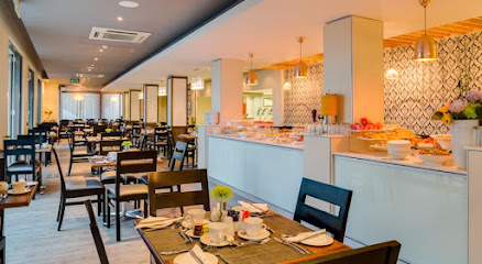 Stonebreakers Restaurant dining room with buffet counter and set tables