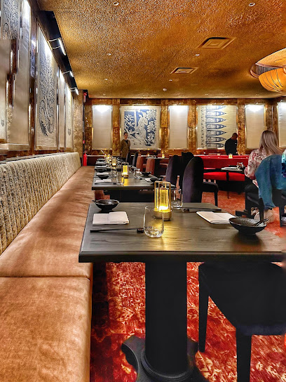 The Red Room dining room at Mount Nelson Hotel with candlelit tables