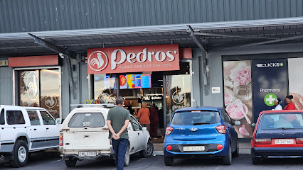 Pedro's Pelican Park storefront with customers and parked cars